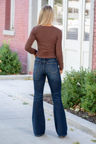 KanCan Jeans  These high-rise flare jeans in a dark stone wash offer comfort stretch and a clean, non-distressed finish with a zip fly. Perfect for a polished and timeless look. Color: Dark Blue Cut: Flare, 34" Inseam*  Rise: High-Rise, 10.5" Front Rise* Material: 99.3% COTTON, 0.7% SPANDEX Stitching: Classic Fly: Zipper Style #: KC7340D *Measured on the smallest size, measurements may vary by size.