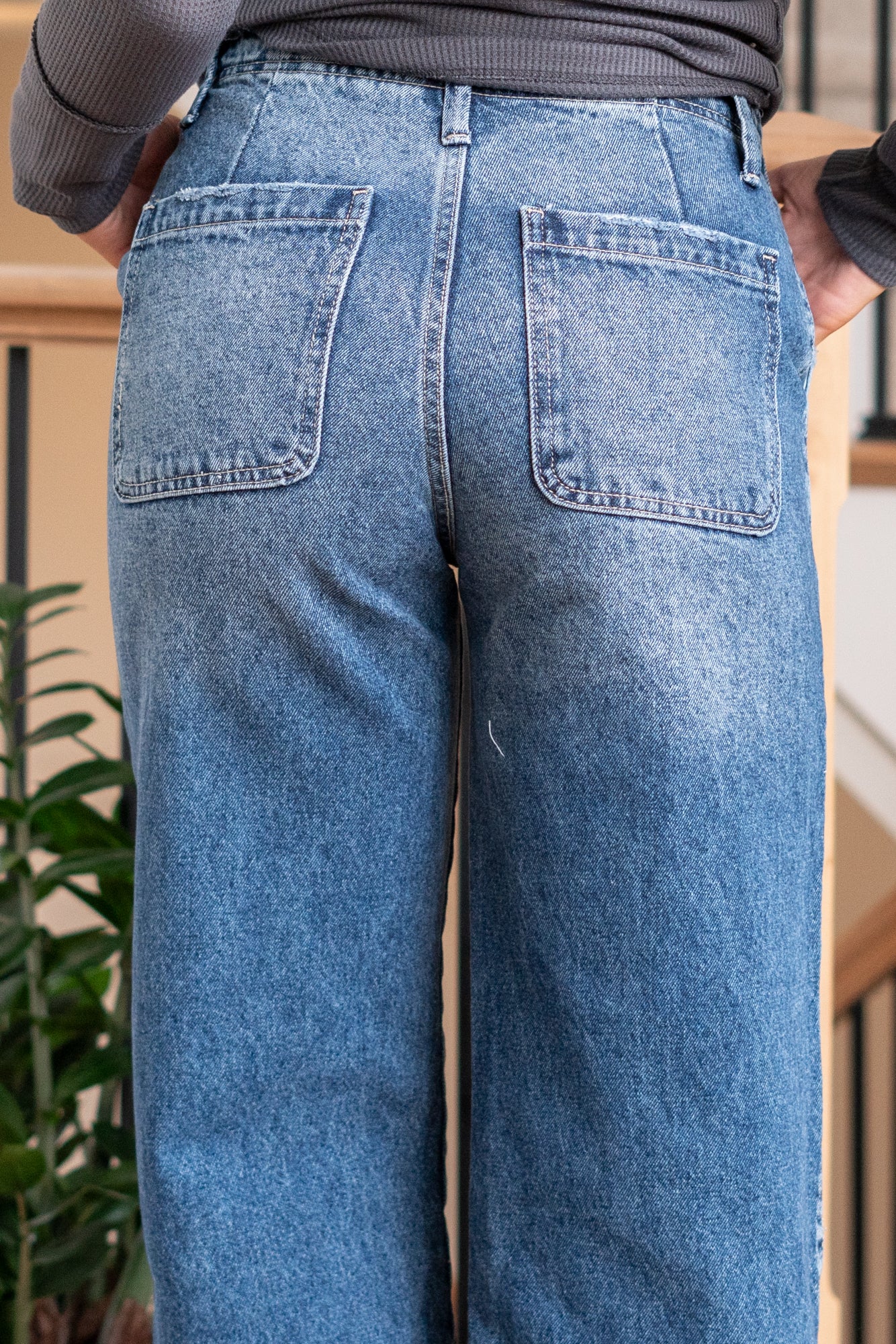 KanCan Jeans   Ultra High Rise 90s Wide Leg Jeans, a nod to the iconic '90s style. While they feature a rigid stretchiness level, these jeans offer a unique design with a hidden button fly, a dart on the back waist, and front slant pockets. The one-inch wide hem adds a trendy twist to complete the look. Color: Dark Wash Cut: FIT, 30" Inseam* Rise:-Rise, 11 1/2" Front Rise* Material: 100% Cotton, Rigid Stitching: Classic Fly: Button Fly Style #: KC7948D