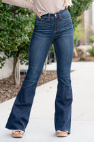 Judy Blue  Don't be afraid to wear high-waisted jeans, especially these flares. With a dark blue wash and a cut hem detail, these will be your favorite denim to dress up. Color: Dark Blue Wash Cut: Flare, 34" Inseam* Rise: High-Rise. 10.75" Front Rise* Material: 52% Cotton / 23% Polyester / 22% Rayon / 3% Spandex Stitching: Classic  Fly: Zipper Style #: JB82343 | 82343 *Measured on the smallest size, measurements may vary by size.  Contact us for any additional measurements or sizing.