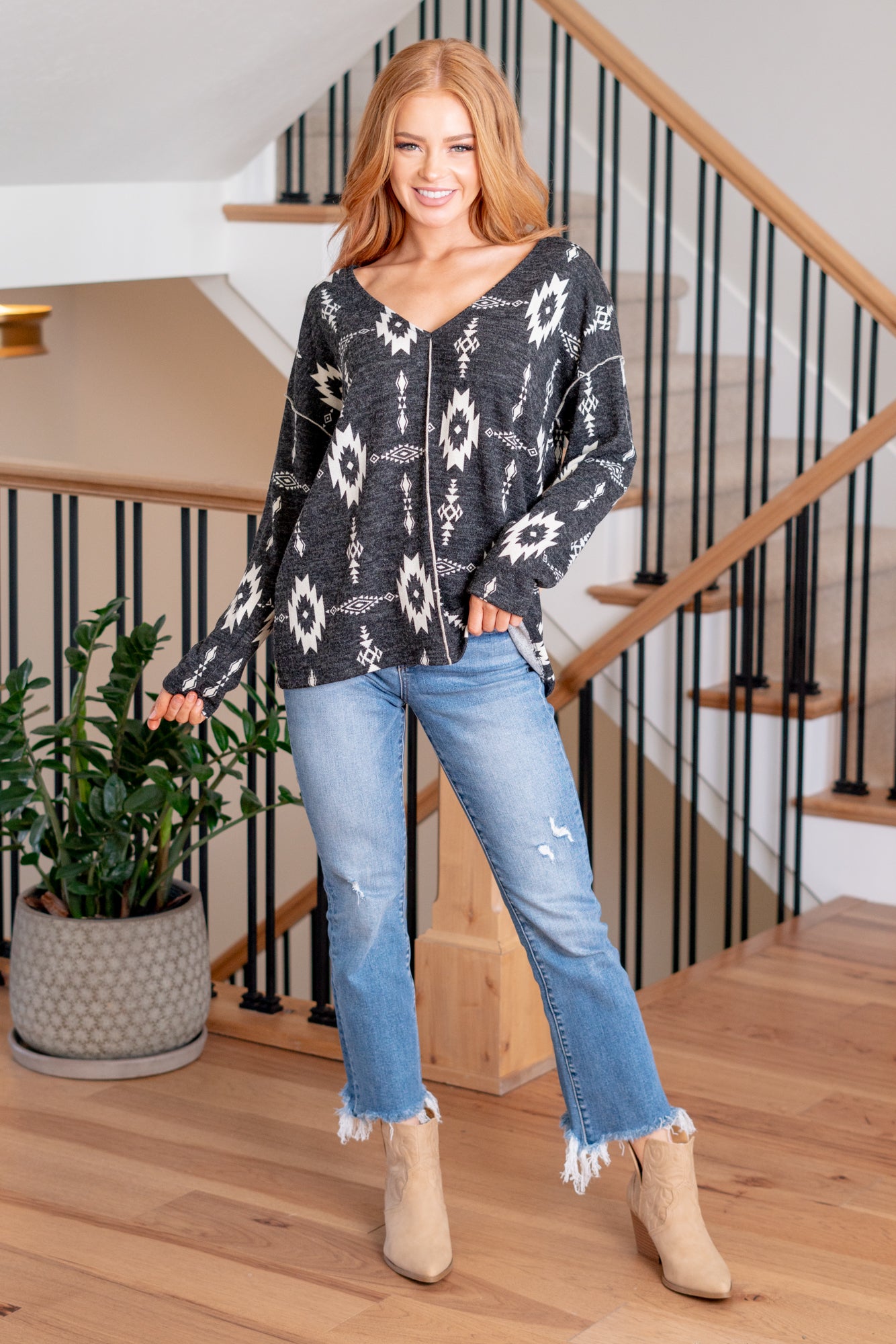 BiBi   Aztec print has such a hold on us! This print top is perfect all season long paired with flared jeans and boots.  Color: Black Neckline: V Neck Long Sleeve Style #: BT1609A-02 Black Contact us for any additional measurements or sizing.       