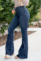 Judy Blue  Don't be afraid to wear high-waisted jeans, especially these flares. With a dark blue wash and a cut hem detail, these will be your favorite denim to dress up. Color: Dark Blue Wash Cut: Flare, 34" Inseam* Rise: High-Rise. 10.75" Front Rise* Material: 52% Cotton / 23% Polyester / 22% Rayon / 3% Spandex Stitching: Classic  Fly: Zipper Style #: JB82343 | 82343 *Measured on the smallest size, measurements may vary by size.  Contact us for any additional measurements or sizing.