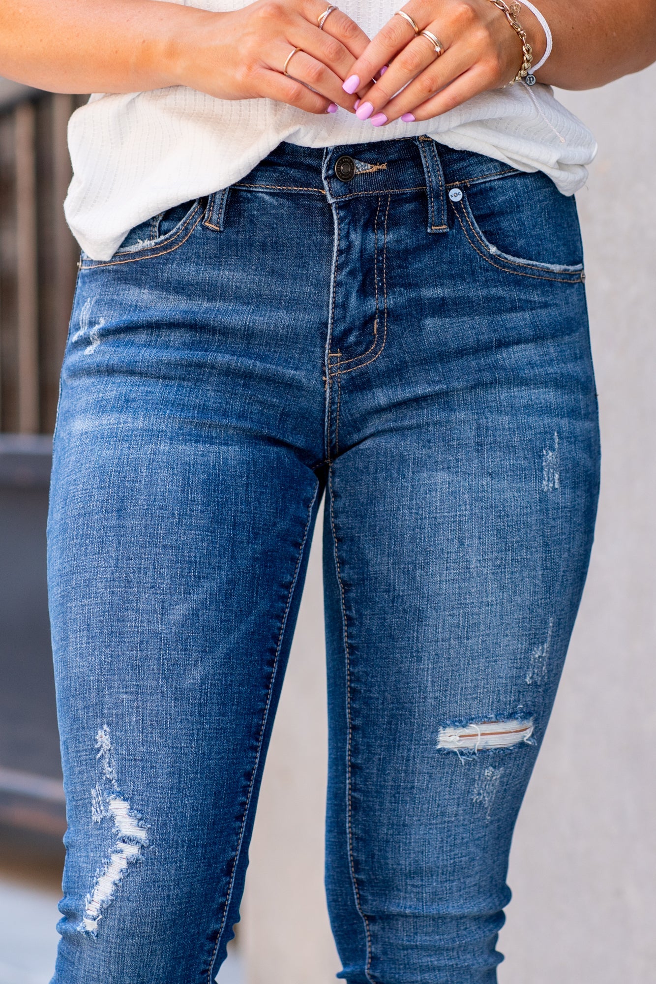 Kan Can Jeans  Color: Dark Wash Cut: Ankle Skinny, 27" Inseam* Rise: Mid-Rise, 8.5" Front Rise* Material: 98% COTTON 2% SPANDEX  Machine Wash Separately In Cold Water Stitching: Classic Fly: Zipper Style #: KC6204D Contact us for any additional measurements or sizing.