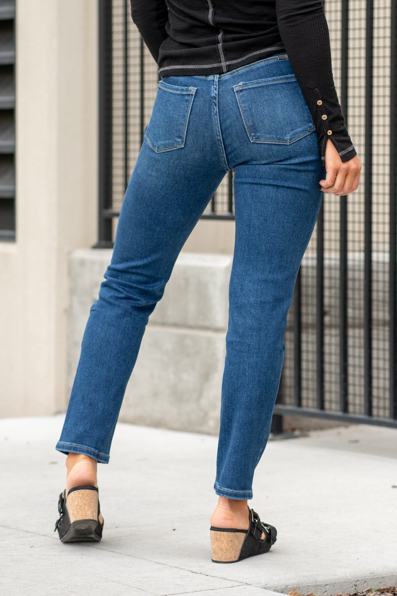 KanCan Jeans  With a high waist and straight fit, these will be your go-to jeans that will never go out of style. Color: Dark Blue  Cut: Straight Fit, 28.5" Inseam* Rise: High-Rise, 11" Front Rise* COTTON 75%, TENCEL 23%,SPANDEX 2% Fly: Zipper Style #: KC11252D Contact us for any additional measurements or sizing.   *Measured on the smallest size, measurements may vary by size.  Sarah wears a size 25 in jeans, a small in tops, and 8 in shoes. She is wearing size 25 in these jeans. 