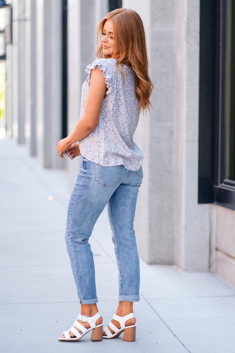 Premium Photo  Lady in long sleeve top. sandals and blue denim