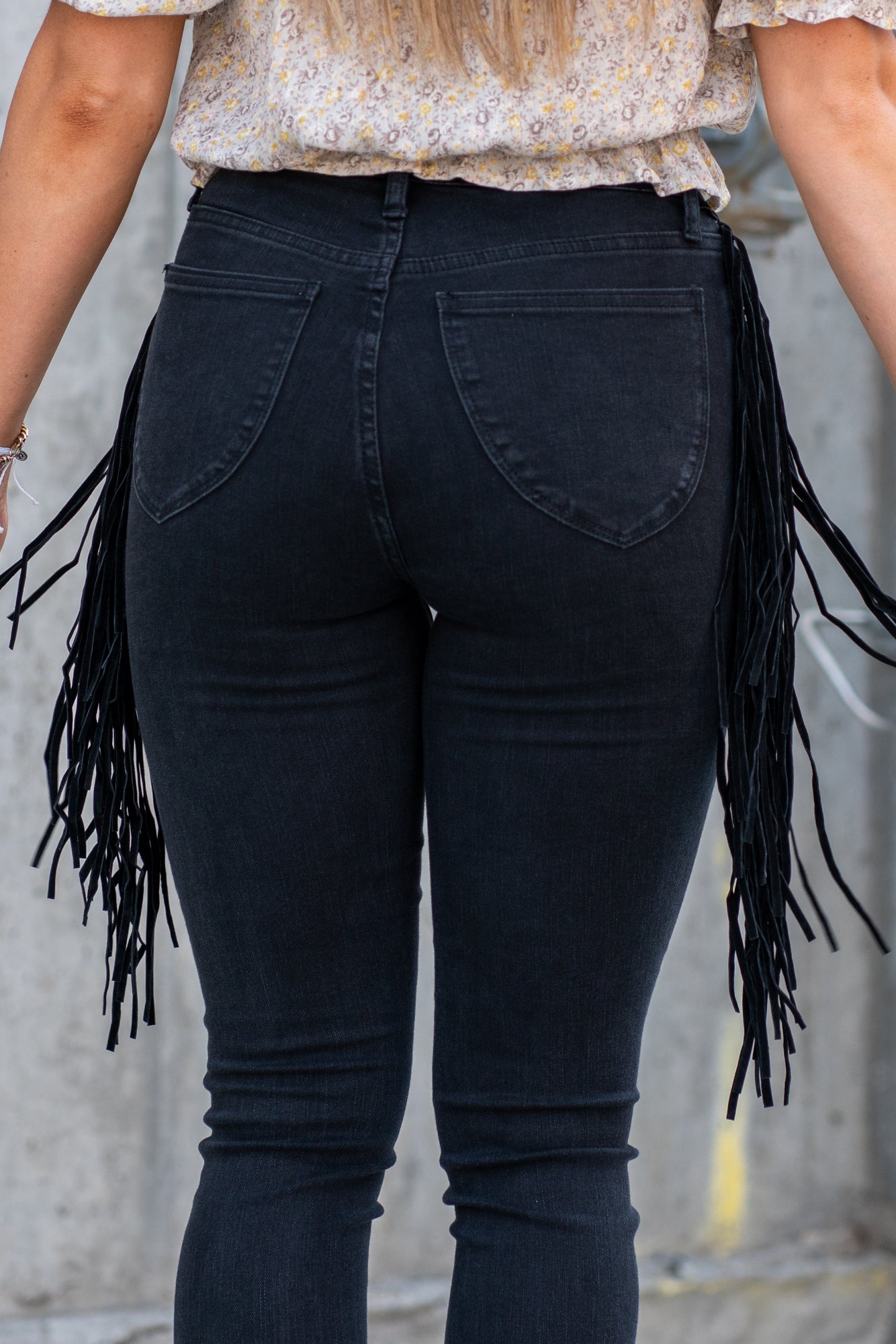 Judy Blue  These pull-on jeggings have a fringe side detail and stretchy band waist. Carefully designed by Judy Blue to pull on and go. With a dark wash in black, these will be your new night-out jeans. Color: Black Cut: Pull-On Skinny, 28" Inseam* Rise: High-Rise, 10.75" Front Rise* Material: 52% Cotton, 22% Rayon, 23% Polyester, 3% Lycra Stitching: Classic  Fly: Pull-On  Style #: JB88497 | 88497 Contact us for any additional measurements or sizing.