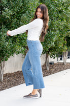 Vervet Flying Monkey Jeans  The Olivia features a super high waist with a wide leg. In the Mischief medium blue wash these jeans feature a cut hem with washing and fading.   Color: Medium Wash  Cut: Cropped Wide Leg, 26* Rise: High Rise, 11" Front Rise* Leg Opening: 19"*  Material: 90% COTTON 8% POLYESTER 2% SPANDEX Machine Wash Separately In Cold Water Stitching: Classic Fly: Zipper Style #: V3063