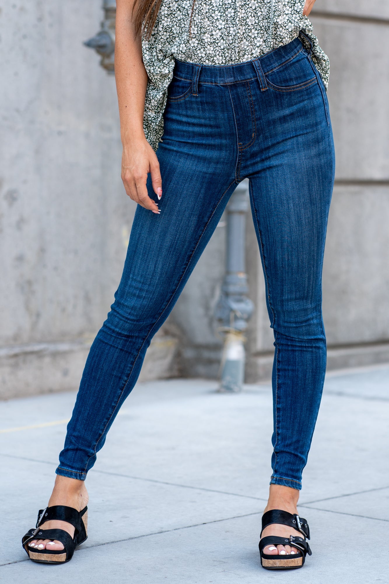 Judy Blue  These pull-on jeggings are stretchy with an elastic band waist. Carefully designed by Judy Blue to pull on and go. With a dark wash in blue, these will be your new night-out jeans. Color: Dark Blue Wash Cut: Pull-On Skinny, 28" Inseam* Rise: High-Rise, 10.75" Front Rise* Material: 52.2%Cotton / 21.5% Rayon / 23.4% Poly / 2.9%Lycra Stitching: Classic  Fly: Pull-On  Style #: JB88539 | 88539