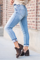 KanCan Jeans  These mom jeans will become your go-to! Pair these girlfriend mom fit with booties and a tee for an easy fall look.  Color: Medium Blue Wash Cut: Straight Fit, 26" Inseam Cuffed* Rise: High-Rise, 11" Front Rise* 94% COTTON , 5% POLYESTER , 1% SPANDEX Fly: Zipper Style #: KC9232M Contact us for any additional measurements or sizing.