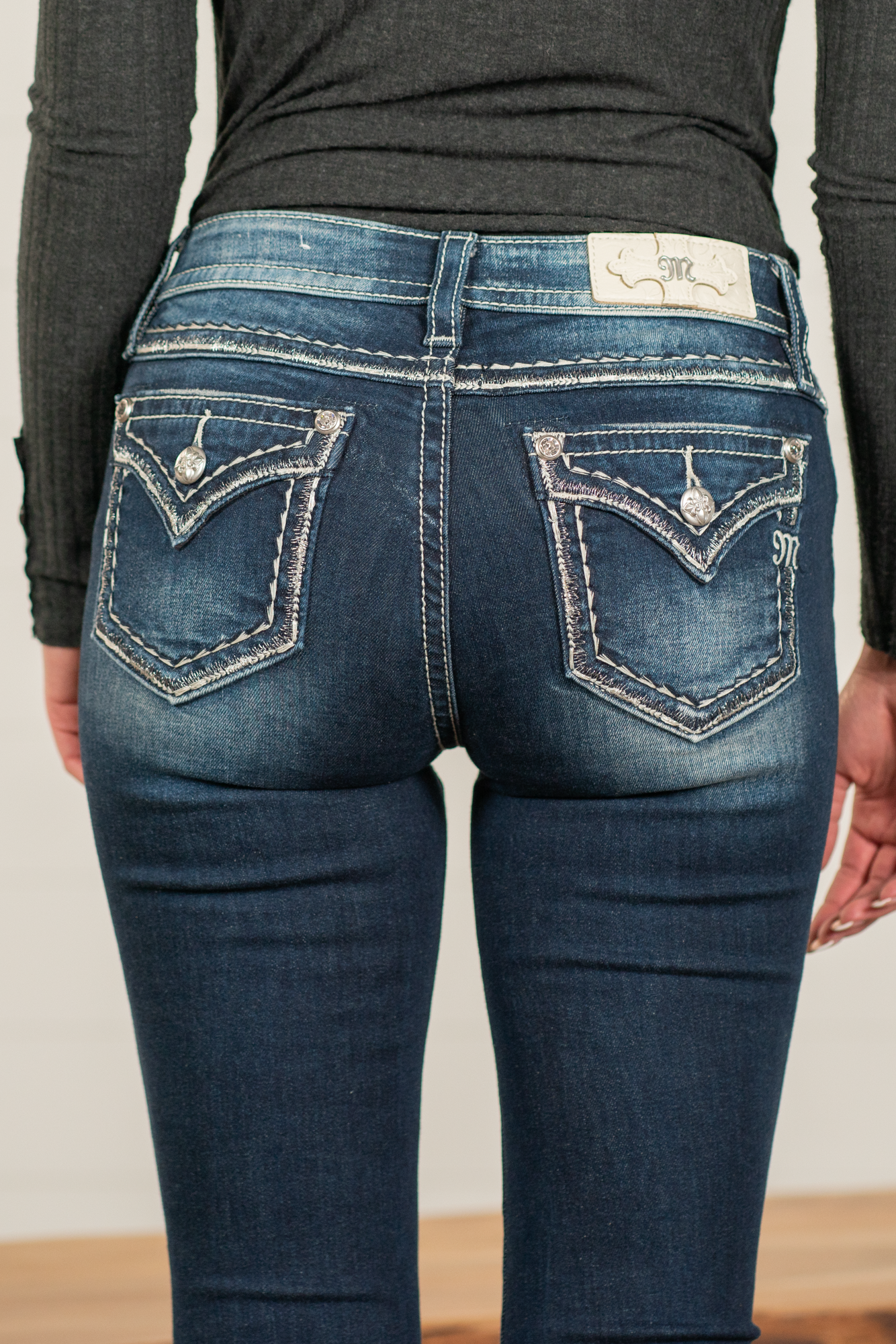 Miss Me  Wear these leopard cactus embellished pocket jeans every day to bling up your wardrobe. Slim boot cut jeans featuring a 5 pocket design, whiskering, and crystal rivets. Wash: Dark Blue Inseam: 34" Slim Boot Cut* Mid Rise, 8.75" Front Rise*