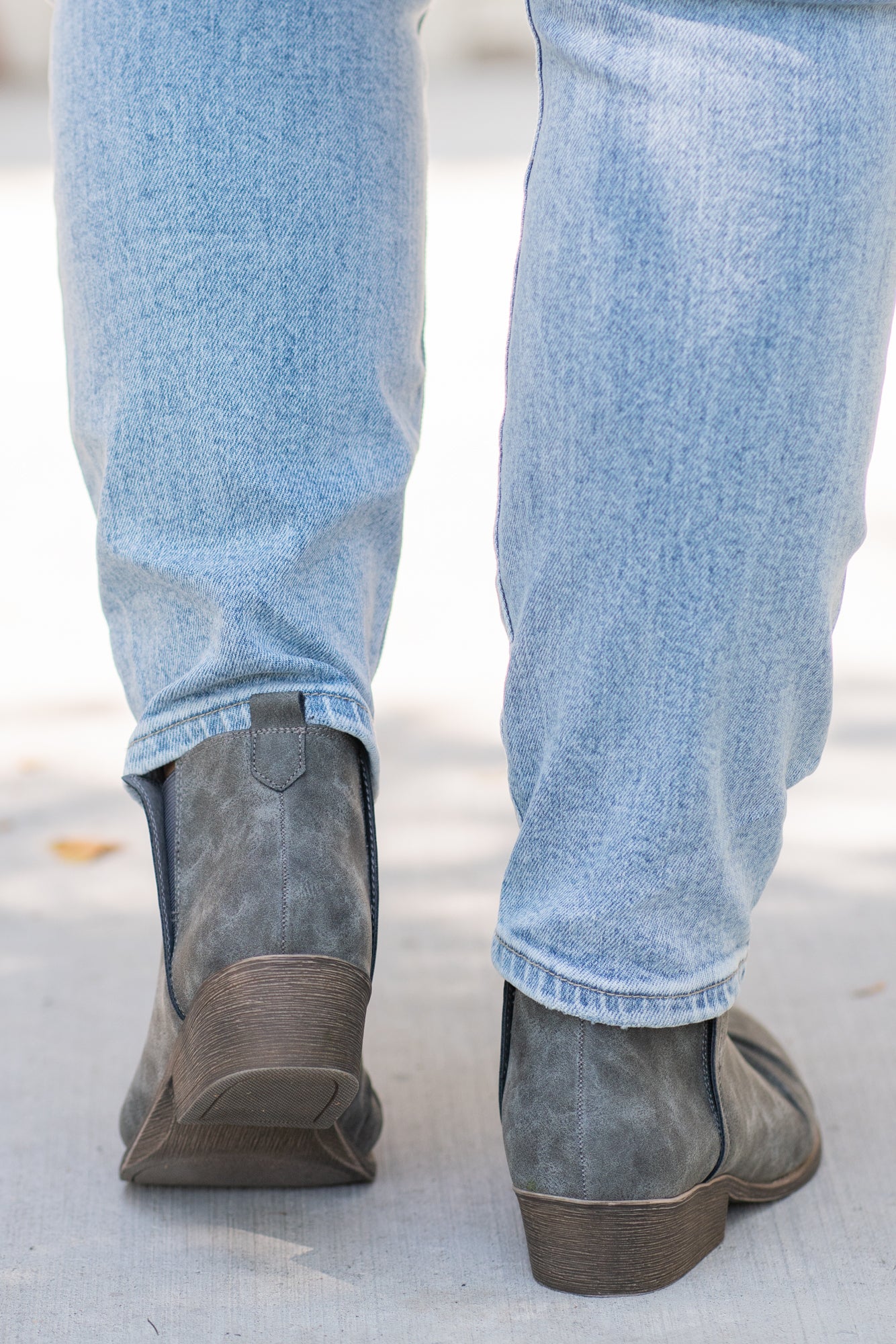 Booties | Very G  These booties from Very G are perfect to wear with boot-cut jeans this fall. The look of a boot without the extra heat from a covered ankle.  Style Name: Juliana  Color: Grey Cut: Silp On Bootie   Rubber Sole Style #: VGLB0277 Contact us for any additional measurements or sizing.