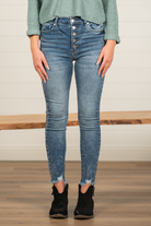 KanCan Jeans  These high-rise blue wash skinny jeans have the classic KanCan exposed button fly. Dress up this denim with a bodysuit or wear them casual with a crop top to accentuate your waistline.   KanCan Stretch Level: Comfort Stretch  Collection: Core Style Color: Dark Wash 94.2% COTTON, 4.7% POLYESTER, 1.1% SPANDEX Cut: Curvy-Fit Skinny, 28" Inseam* Rise: High-Rise, 11" Front Rise* Stitching: Classic Fly: Exposed Button Fly  Style #: BM7273HWM Contact us for any additional measurements or sizing.