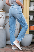 Flying Monkey Jeans  Those rigid mom jeans from the 90's! With no stretch, distressing throughout, and a high waist you will feel stylish and fun. Name: Elastic Blue Cut: Straight Fit, 28" Inseam* Rise: High Rise, 9" Front Rise* 100% Cotton Stitching: Classic Style #: F4262  Contact us for any additional measurements or sizing.   *Measured on the smallest size, measurements may vary by size. 