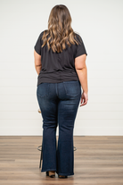 KanCan Jeans   KanCan Plus Size Guide:   XL-16 2XL-18 3XL-20  Color: Dark Wash Cut: Flare Cut, 34" Inseam* Rise: High-Rise, 10.5" Front Rise* Material: 94% Cotton 4% Polyester2% Spandex Detail: Whisker Wash Fly: Zipper Fly with Double Button Closure Style #: KC7123D-P Contact us for any additional measurements or sizing.  *Measured on the smallest size, measurements may vary by size.