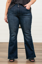 KanCan Jeans   KanCan Plus Size Guide:   XL-16 2XL-18 3XL-20  Color: Dark Wash Cut: Flare Cut, 34" Inseam* Rise: High-Rise, 10.5" Front Rise* Material: 94% Cotton 4% Polyester2% Spandex Detail: Whisker Wash Fly: Zipper Fly with Double Button Closure Style #: KC7123D-P Contact us for any additional measurements or sizing.  *Measured on the smallest size, measurements may vary by size.