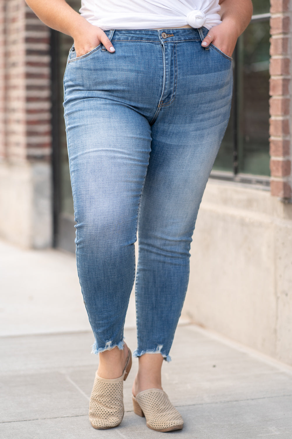 KanCan Jeans  Collection: Core Style Color: Medium Wash Cut: Ankle Skinny, 27" Inseam Rise: High-Rise, 9.5" Front Rise COTTON 91.9% POLYESTER 7% SPANDEX 1.1% Fly: Zipper  Style #: KC7274M Contact us for any additional measurements or sizing.  Victoria is wearing a size 2XL in these jeans.